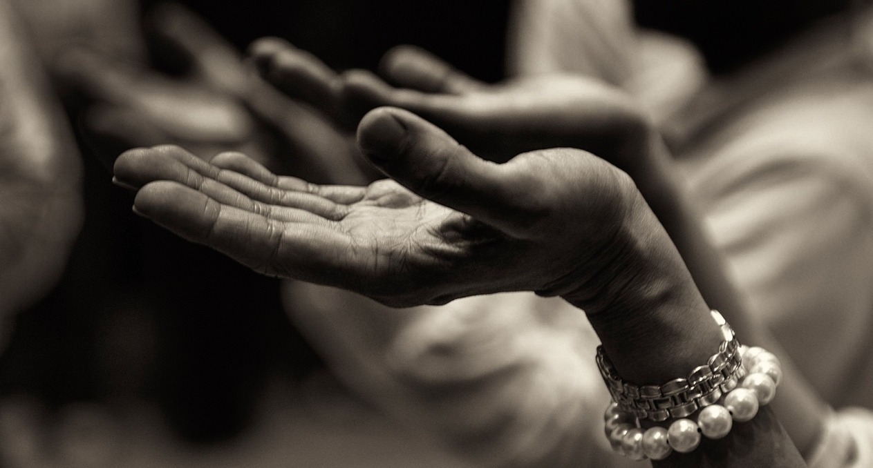 hands raised in prayer